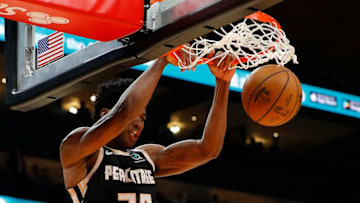 ATLANTA, GEORGIA - DECEMBER 02: Damian Jones #30 of the Atlanta Hawks dunks against Eric Paschall #7 of the Golden State Warriors in the second half at State Farm Arena on December 02, 2019 in Atlanta, Georgia. NOTE TO USER: User expressly acknowledges and agrees that, by downloading and/or using this photograph, user is consenting to the terms and conditions of the Getty Images License Agreement. (Photo by Kevin C. Cox/Getty Images)