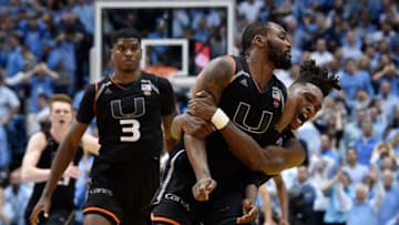 CHAPEL HILL, NC - FEBRUARY 27: Ja'Quan Newton #0 of the Miami Hurricanes celebrates with teammates after making the game-winning basket against the North Carolina Tar Heels during their game at the Dean Smith Center on February 27, 2018 in Chapel Hill, North Carolina. Miami won 91-88. (Photo by Grant Halverson/Getty Images)