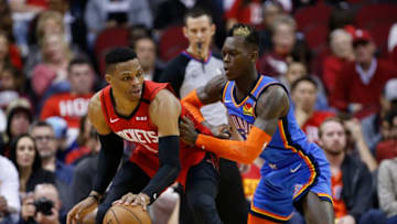 JANUARY 20: Russell Westbrook #0 of the Houston Rockets is guarded by Dennis Schroder #17 of the OKC Thunder during the fourth quarter (Photo by Bob Levey/Getty Images)
