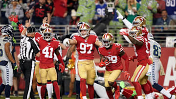 SANTA CLARA, CALIFORNIA - NOVEMBER 11: Strong safety Jaquiski Tartt #29 and defensive end Nick Bosa #97 of the San Francisco 49ers look to the official after Tartt strips the ball from wide receiver D.K. Metcalf #14 of the Seattle Seahawks at the two yard line to prevent a Seattle Seahawks touchdown in the second quarter at Levi's Stadium on November 11, 2019 in Santa Clara, California. (Photo by Thearon W. Henderson/Getty Images)