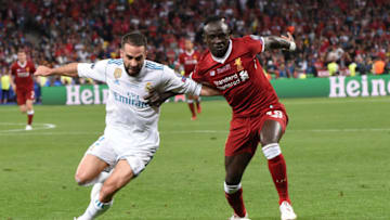 KIEV, UKRAINE - MAY 26: Dani Carvajal of Real Madrid and Sadio Mane of Liverpool compete for the ball during the UEFA Champions League final between Real Madrid and Liverpool at NSC Olimpiyskiy Stadium on May 26, 2018 in Kiev, Ukraine. (Photo by Etsuo Hara/Getty Images)