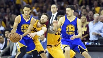 Jun 11, 2015; Cleveland, OH, USA; Golden State Warriors guard Stephen Curry (30) handles the ball against Cleveland Cavaliers guard Matthew Dellavedova (8) during the third quarter in game four of the NBA Finals at Quicken Loans Arena. Mandatory Credit: Bob Donnan-USA TODAY Sports