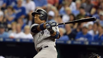 Aug 29, 2016; Kansas City, MO, USA; New York Yankees second baseman Starlin Castro (14) drives in a run with a double against the Kansas City Royals in the fourth inning at Kauffman Stadium. Mandatory Credit: John Rieger-USA TODAY Sports