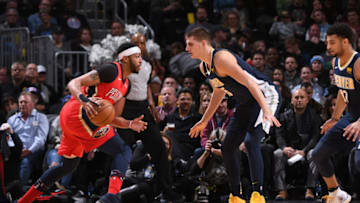 DENVER, CO - DECEMBER 15: Anthony Davis #23 of the New Orleans Pelicans handles the ball against Nikola Jokic #15 of the Denver Nuggets on December 15, 2017 at the Pepsi Center in Denver, Colorado. NOTE TO USER: User expressly acknowledges and agrees that, by downloading and/or using this Photograph, user is consenting to the terms and conditions of the Getty Images License Agreement. Mandatory Copyright Notice: Copyright 2017 NBAE (Photo by Garrett Ellwood/NBAE via Getty Images)