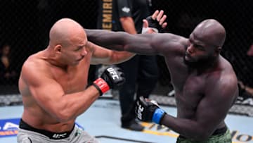 LAS VEGAS, NEVADA - AUGUST 15: In this handout image provided by UFC, Jairzinho Rozenstruik (R) of Suriname punches Junior Dos Santos of Brazil in their heavyweight bout during the UFC 252 event at UFC APEX on August 15, 2020 in Las Vegas, Nevada. (Photo by Jeff Bottari/Zuffa LLC via Getty Images)
