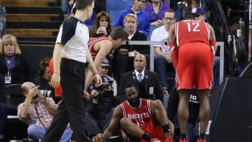Dec 15, 2013; Sacramento, CA, USA; Houston Rockets shooting guard James Harden (13) holds his ankle after a play against the Sacramento Kings during the third quarter at Sleep Train Arena. The Sacramento Kings defeated the Houston Rockets 106-91. Mandatory Credit: Kelley L Cox-USA TODAY Sports