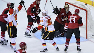 Dec 19, 2016; Glendale, AZ, USA; Calgary Flames center Mikael Backlund (11) celebrates with center Sam Bennett (93) after scoring a power play goal as Arizona Coyotes goalie Mike Smith (41), defenseman Alex Goligoski (33) and defenseman Connor Murphy (5) react during the second period at Gila River Arena. Mandatory Credit: Matt Kartozian-USA TODAY Sports