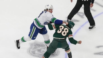 EDMONTON, ALBERTA - AUGUST 07: Jake Virtanen #18 of the Vancouver Canucks and Ryan Hartman #38 of the Minnesota Wild fight during the first period in Game Four of the Western Conference Qualification Round prior to the 2020 NHL Stanley Cup Playoffs at Rogers Place on August 07, 2020 in Edmonton, Alberta. (Photo by Jeff Vinnick/Getty Images)