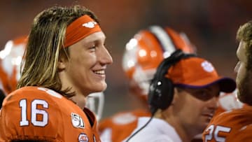 CLEMSON, SOUTH CAROLINA - OCTOBER 26: Quarterback Trevor Lawrence #16 of the Clemson Tigers talks with teammates on the sideline during the Tigers' football game against the Boston College Eagles at Memorial Stadium on October 26, 2019 in Clemson, South Carolina. (Photo by Mike Comer/Getty Images)