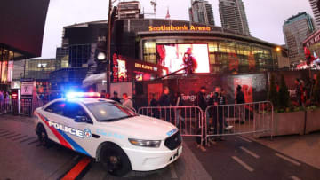 Police provide security outside the arena as fans gather at Jurassic Park at Scotiabank Arena. (Photo by Tom Szczerbowski/Getty Images)