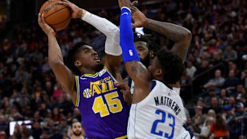 SALT LAKE CITY, UT - NOVEMBER 07: Donovan Mitchell #45 of the Utah Jazz goes to the basket against Wesley Matthews #23 and DeAndre Jordan #6 of the Dallas Mavericks in the second half of a NBA game at Vivint Smart Home Arena on November 7, 2018 in Salt Lake City, Utah. NOTE TO USER: User expressly acknowledges and agrees that, by downloading and or using this photograph, User is consenting to the terms and conditions of the Getty Images License Agreement. (Photo by Gene Sweeney Jr./Getty Images)