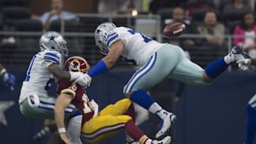 Jan 3, 2016; Arlington, TX, USA; Washington Redskins quarterback Colt McCoy (16) is sacked by Dallas Cowboys defensive end Greg Hardy (76) and cornerback Terrance Mitchell (21) during the second quarter at AT&T Stadium. Mandatory Credit: Jerome Miron-USA TODAY Sports