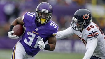 Dec 20, 2015; Minneapolis, MN, USA; Minnesota Vikings running back Jerick McKinnon (31) rushes for a touchdown away from Chicago Bears linebacker Shea McClellin (50) in the second quarter at TCF Bank Stadium. The Vikings win 38-17. Mandatory Credit: Bruce Kluckhohn-USA TODAY Sports