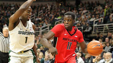 Jan 4, 2017; East Lansing, MI, USA; Rutgers Scarlet Knights forward Eugene Omoruyi (11) drives the baseline against Michigan State Spartans guard Joshua Langford (1) during the first half of a game at the Jack Breslin Student Events Center. Mandatory Credit: Mike Carter-USA TODAY Sports