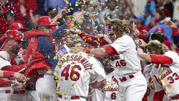 May 23, 2022; St. Louis, Missouri, USA; St. Louis Cardinals first baseman Paul Goldschmidt (46) is congratulated by teammates at home plate after hitting a walk-off grand slam against the Toronto Blue Jays during the tenth inning at Busch Stadium. Mandatory Credit: Jeff Curry-USA TODAY Sports