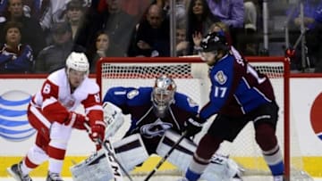 Feb 5, 2015; Denver, CO, USA; Detroit Red Wings left wing Justin Abdelkader (8) attempts to score on Colorado Avalanche goalie Semyon Varlamov (1) as defenseman Brad Stuart (17) defends in the second period at the Pepsi Center. Mandatory Credit: Ron Chenoy-USA TODAY Sports