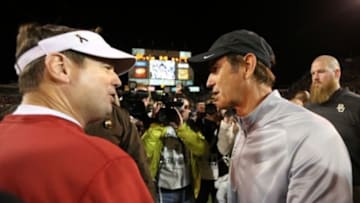 Nov 7, 2013; Waco, TX, USA; Baylor Bears head coach Art Briles meets with Oklahoma Sooners head coach Bob Stoops after the game at Floyd Casey Stadium. Baylor beat Oklahoma 41-12. Mandatory Credit: Matthew Emmons-USA TODAY Sports