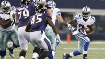 Aug 16, 2014; Arlington, TX, USA; Dallas Cowboys running back Ryan Williams (34) runs with the ball in the fourth quarter against the Baltimore Ravens at AT&T Stadium. Mandatory Credit: Matthew Emmons-USA TODAY Sports