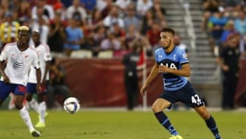 Jul 29, 2015; Denver, CO, USA; Tottenham Hotspur midfielder Nabil Bentaleb (42) plays the ball as MLS All Stars forward Gyasi Zardes (30) of the LA Galaxy looks on during the first half of the 2015 MLS All Star Game at Dick's Sporting Goods Park. Mandatory Credit: Isaiah J. Downing-USA TODAY Sports