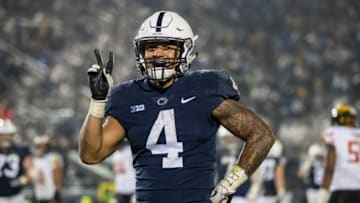 STATE COLLEGE, PA - NOVEMBER 24: Ricky Slade #4 of the Penn State Nittany Lions reacts after scoring his second touchdown against the Maryland Terrapins during the second half at Beaver Stadium on November 24, 2018 in State College, Pennsylvania. (Photo by Scott Taetsch/Getty Images)