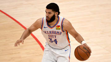 Kenrich Williams #34 of the Oklahoma City Thunder dribbles against the Washington Wizards during the second half at Capital One Arena on April 19, 2021 in Washington, DC. NOTE TO USER: User expressly acknowledges and agrees that, by downloading and or using this photograph, User is consenting to the terms and conditions of the Getty Images License Agreement. (Photo by Will Newton/Getty Images)