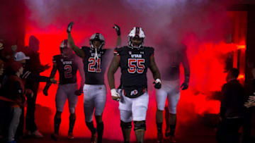 SALT LAKE CITY, UT - OCTOBER 16: Nick Ford #55, Solomon Enis #2, Micah Bernard #2, and Devin Kaufusi #90 of the Utah Utes lead the team onto the field before the start of their game against the Arizona State Sun Devils October 13, 2021 at Rice-Eccles Stadium in Salt Lake City, Utah. (Photo by Chris Gardner/Getty Images)