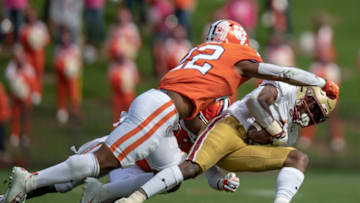 Oct 31, 2020; Clemson, South Carolina, USA; Clemson Tigers linebacker Trenton Simpson (22) tackles Boston College Eagles receiver Jehlani Galloway (13) during the third quarter at Memorial Stadium. Mandatory Credit: Josh Morgan-USA TODAY Sports