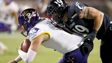 Ethan Tucky of the Cincinnati Bearcats sacks Holton Ahlers of the East Carolina Pirates at Nippert Stadium. Getty Images.