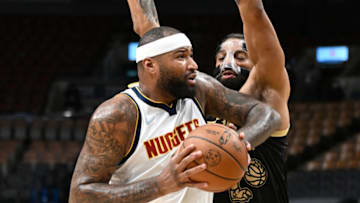 Denver Nuggets center DeMarcus Cousins (4) drives against Toronto Raptors center Khem Birch (24) in the first half at Scotiabank Arena on 12 Feb. 2022. (Dan Hamilton-USA TODAY Sports)