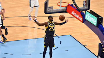 Apr 11, 2021; Memphis, Tennessee, USA; Indiana Pacers guard Caris LeVert (22) dunks during the second half against the Memphis Grizzlies at FedExForum. Mandatory Credit: Justin Ford-USA TODAY Sports