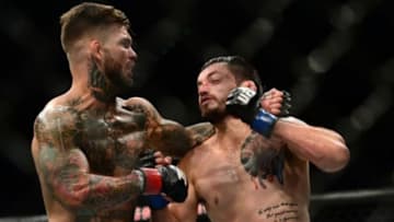 Jul 11, 2015; Las Vegas, NV, USA; Cody Garbrandt (red gloves) and Henry Briones (blue gloves) fight during UFC 189 at MGM Grand Garden Arena. Garbrandt won via unanimous decision. Mandatory Credit: Joe Camporeale-USA TODAY Sports