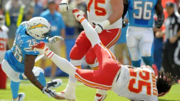 Oct 19, 2014; San Diego, CA, USA; San Diego Chargers cornerback Brandon Flowers (26) and Kansas City Chiefs running back Jamaal Charles (25) collide as Charles crosses the goal line for a touchdown during the second quarter at Qualcomm Stadium. Mandatory Credit: Jake Roth-USA TODAY Sports