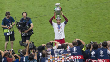 PARIS, FRANCE - JULY 10: Portugal's Cristiano Ronaldo poses with the winners trophy during the UEFA Euro 2016 Final match between Portugal and France at Stade de Lyon on July 10 in Paris, France. (Photo by Craig Mercer/CameraSport via Getty Images)