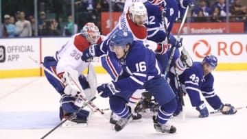 Oct 2, 2016; Toronto, Ontario, CAN; Toronto Maple Leafs forward Mitch Marner (16) goes after the puck against the Montreal Canadiens during a preseason hockey game at Air Canada Centre. The Maple Leafs beat the Canadiens 3-2 in overtime. Mandatory Credit: Tom Szczerbowski-USA TODAY Sports