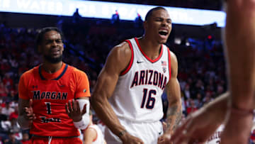 Nov 6, 2023; Tucson, Arizona, USA; Arizona Wildcats forward Keshad Johnson (16) celebrates after a block against Morgan State Bears guard Wynston Tabbs (1) during the first quarter at McKale Center. Mandatory Credit: Zachary BonDurant-USA TODAY Sports