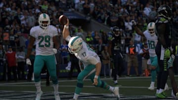 Sep 11, 2016; Seattle, WA, USA; Miami Dolphins quarterback Ryan Tannehill (17) spikes the ball in celebration after scoring on a 2-yard touchdown run in the fourth quarter against the Seattle Seahawks during a NFL game at CenturyLink Field. The Seahawks defeated the Dolphins 12-10. Mandatory Credit: Kirby Lee-USA TODAY Sports