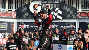 WATKINS GLEN, NY - AUGUST 06: Martin Truex Jr., driver of the #78 Furniture Row/Denver Mattress Toyota, celebrates in victory lane after winning the Monster Energy NASCAR Cup Series I Love NY 355 at The Glen at Watkins Glen International on August 6, 2017 in Watkins Glen, New York. (Photo by Jared C. Tilton/Getty Images)