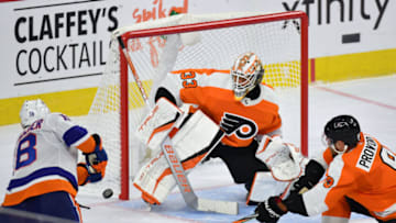 Sep 28, 2021; Philadelphia, Pennsylvania, USA; New York Islanders left wing Anthony Beauvillier (18) scores the game-winning goal in overtime against Philadelphia Flyers goaltender Samuel Ersson (33) and defenseman Ivan Provorov (9) at Wells Fargo Center. Mandatory Credit: Eric Hartline-USA TODAY Sports