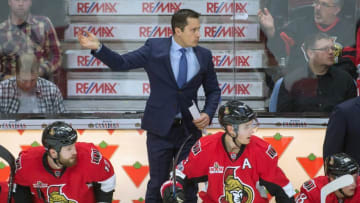 Jan 7, 2017; Ottawa, Ontario, CAN; Ottawa Senators head coach Guy Boucher calls in the goalie in the last minute of play of the third period against the Washington Capitals at the Canadian Tire Centre. The Capitals defeated the Senators 1-0. Mandatory Credit: Marc DesRosiers-USA TODAY Sports