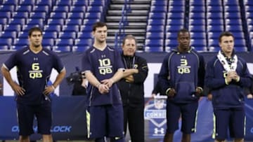 Feb 23, 2014; Indianapolis, IN, USA; Eastern Illinois quarterback James Garoppolo (FL), Alabama Crimson Tide quarterback A.J. McCarron (L), Louisville Cardinals quarterback Teddy Bridgewater (R), and Texas A&M Aggies quarterback Johnny Manziel (FR) look on during the 2014 NFL Combine at Lucas Oil Stadium. Mandatory Credit: Brian Spurlock-USA TODAY Sports