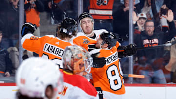 PHILADELPHIA, PENNSYLVANIA - NOVEMBER 16: Kevin Hayes #13 of the Philadelphia Flyers celebrates with teammates after scoring against the Calgary Flames during the second period at Wells Fargo Center on November 16, 2021 in Philadelphia, Pennsylvania. (Photo by Tim Nwachukwu/Getty Images)