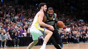 BOSTON, MA - JANUARY 26: Kyrie Irving #11 of the Boston Celtics drives to the basket while guarded by Klay Thompson #11 of the golden State Warriors during a game at TD Garden on January 26, 2019 in Boston, Massachusetts. NOTE TO USER: User expressly acknowledges and agrees that, by downloading and or using this photograph, User is consenting to the terms and conditions of the Getty Images License Agreement. (Photo by Adam Glanzman/Getty Images)
