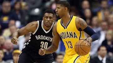Dec 18, 2015; Indianapolis, IN, USA; Indiana Pacers forward Paul George (13) is guarded by Brooklyn Nets forward Thaddeus Young (30) at Bankers Life Fieldhouse. Indiana defeats Brooklyn 104-97. Mandatory Credit: Brian Spurlock-USA TODAY Sports