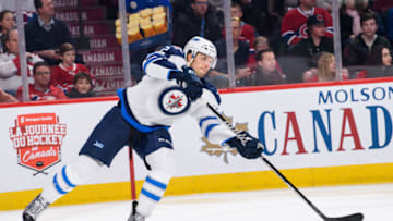 MONTREAL, QC - FEBRUARY 18: Winnipeg Jets defenseman Ben Chiarot (7) passes the puck during the first period of the NHL regular season game between the Winnipeg Jets and the Montreal Canadiens on February 18, 2017, at the Bell Centre in Montreal, QC (Photo by Vincent Ethier/Icon Sportswire via Getty Images)
