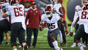 Nov 13, 2021; Eugene, Oregon, USA; Washington State Cougars running back Nakia Watson (25) runs the ball during warm ups before a game against the Oregon Ducks at Autzen Stadium. Mandatory Credit: Troy Wayrynen-USA TODAY Sports