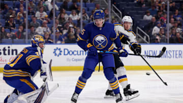 Apr 14, 2022; Buffalo, New York, USA; Buffalo Sabres defenseman Owen Power (25) defends as St. Louis Blues center Ivan Barbashev (49) looks to deflect a shot on Buffalo Sabres goaltender Craig Anderson (41) during the third period at KeyBank Center. Mandatory Credit: Timothy T. Ludwig-USA TODAY Sports