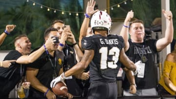ORLANDO, FL - SEPTEMBER 28: DUPLICATE***UCF Knights defensive lineman Brandon Wilson (13)***UCF Knights wide receiver Gabriel Davis (13) scores how 3rd touchdown during the football game between the UCF Knights and the UConn Huskies on September 28, 2019 at Bright House Networks Stadium in Orlando, FL. (Photo by Andrew Bershaw/Icon Sportswire via Getty Images)