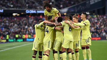 LONDON, ENGLAND - MAY 01: Rob Holding of Arsenal celebrates scoring their side's first goal with teammates during the Premier League match between West Ham United and Arsenal at London Stadium on May 01, 2022 in London, England. (Photo by Justin Setterfield/Getty Images)