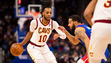 Jan 30, 2022; Detroit, Michigan, USA; Cleveland Cavaliers guard Darius Garland (10) gets defended by Detroit Pistons guard Cory Joseph (18) during the first quarter at Little Caesars Arena. Mandatory Credit: Raj Mehta-USA TODAY Sports