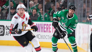 DALLAS, TX - MARCH 5: Marc Methot #33 of the Dallas Stars plays the puck ahead against Mark Stone #61 of the Ottawa Senators at the American Airlines Center on March 5, 2018 in Dallas, Texas. (Photo by Glenn James/NHLI via Getty Images)